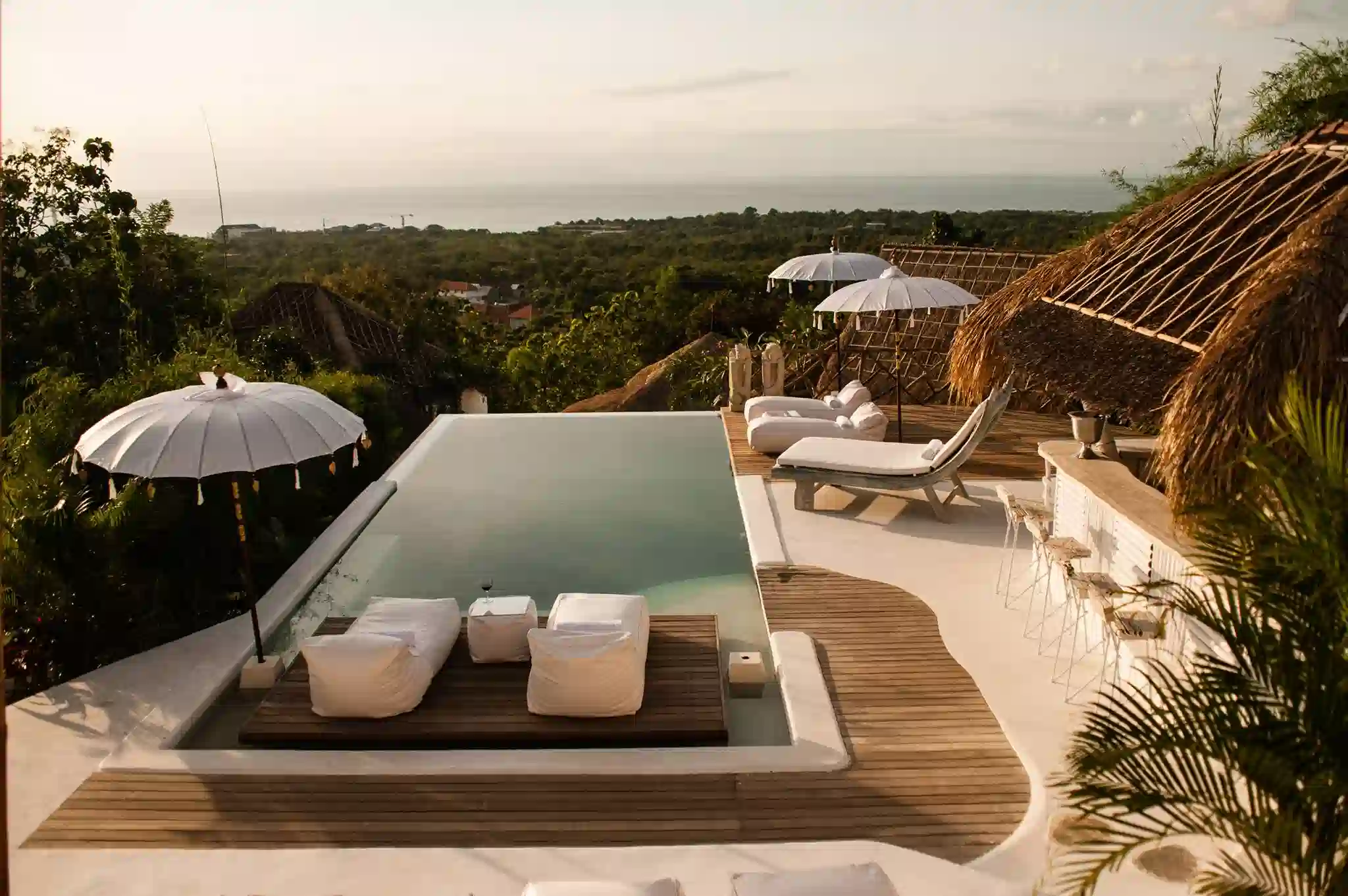 Boho-style cliffside villas at Gravity Hotel Uluwatu surrounded by limestone landscape