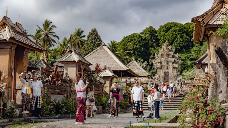 Tourists wearing traditional clothes in Penglipuran Village Bali